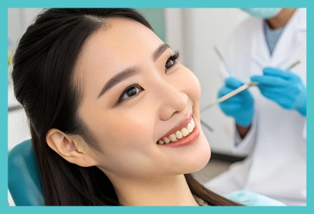 A woman smiling in a dental chair, used as a representative image for internal tooth whitening information.